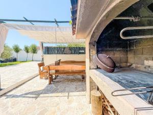 a outdoor grill with a hammock and a chair at Holiday Home Tina & Tino by Interhome in Briševo