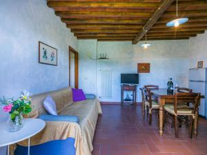 a living room with a couch and a table at Apartment Lavanda by Interhome in Lucolena in Chianti +35 photos