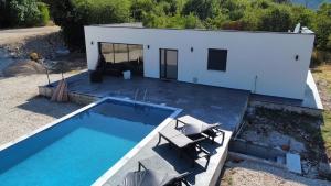 an aerial view of a house with a swimming pool at Villa Leona in Neum +13 photos