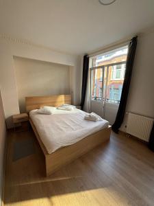 Postel nebo postele na pokoji v ubytování Perfect Stay for Events 1BR and Sofa Bed near Expo 12