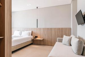 Postel nebo postele na pokoji v ubytování Hotel Portanova