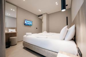 Postel nebo postele na pokoji v ubytování Hotel Portanova