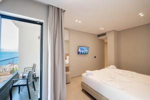 Postel nebo postele na pokoji v ubytování Hotel Portanova