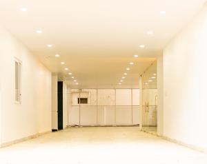 an empty room with white walls and ceilings at Elite Vistara in Tirupati