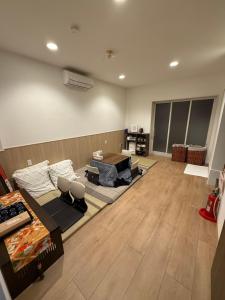 Postel nebo postele na pokoji v ubytování 京都缘屋九条店kyoto-Enishiya guesthouse kujo NEW OPEN 新开业免费西式早餐