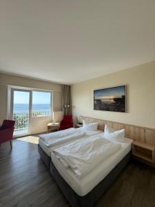 Rúm í herbergi á Rügen-Hotel