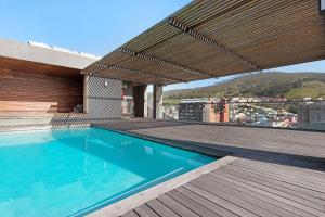 a swimming pool on the roof of a building at Neighbourgood Loop Street in Cape Town