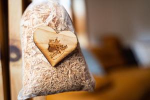 a heart shaped tag with a castle on it at Ferienwohnung Tamara in Patergassen +17 photos