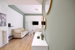 a living room with a couch and a table at HC - Charming Apartment in Vigna Clara in Rome