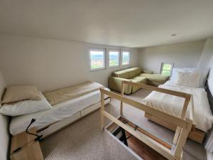 a room with two bunk beds and a couch at Lake Horizon in Balatonfüred