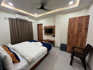 En eller flere senge i et værelse på Hotel MD Star