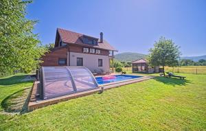 a swimming pool in the yard of a house at Villa Debelo Brdo by Villas Guide in Debelo Brdo
