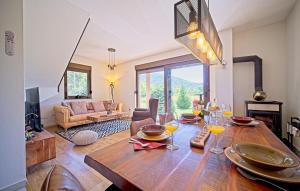 a living room with a wooden table with wine glasses at Villa Debelo Brdo by Villas Guide in Debelo Brdo