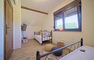 a small bedroom with a bed and a window at Villa Debelo Brdo by Villas Guide in Debelo Brdo +36 photos