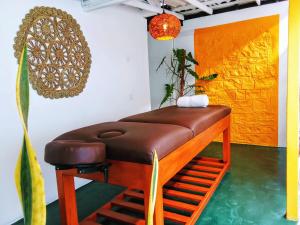 a brown bar stool in a room with a plant at Subhasha Summer House in Talalla South
