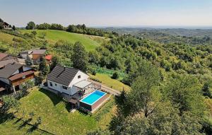 an aerial view of a house with a swimming pool at Holiday Home Lipa by Villas Guide in Ivančići