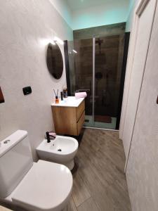 a bathroom with a toilet and a sink and a shower at Casa Borgo&Mare - Barletta in Barletta