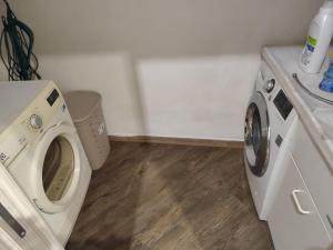 a laundry room with a washing machine and a washer at Casa Borgo&Mare - Barletta in Barletta