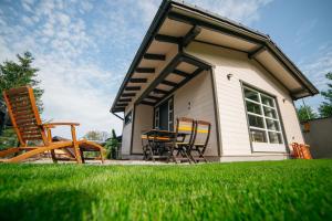a group of chairs sitting outside of a house at Hedera Sovata 2 in Sovata