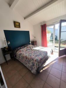 En eller flere senge i et værelse på Sur les dunes