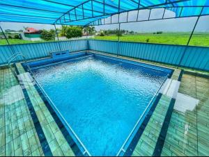 Πισίνα στο ή κοντά στο Ganesh Farm House