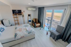 a bedroom with a bed and a balcony at İstanbul Airport Black Sea Hotel in Arnavutköy +84 photos