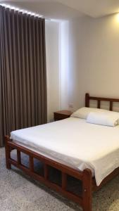 Postel nebo postele na pokoji v ubytování Arenas Hotel