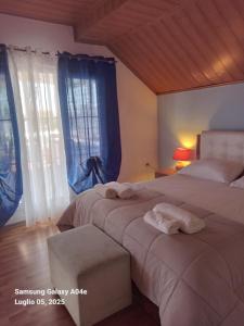 a bedroom with two beds with towels on them at Villa Mondi in Durrës +124 photos