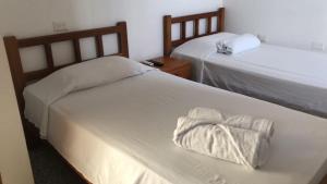 Postel nebo postele na pokoji v ubytování Arenas Hotel