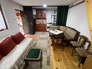 a living room with a couch and a table at Kraljeva breza in Divčibare