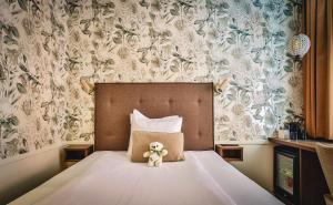 Postel nebo postele na pokoji v ubytování Freys Hotel