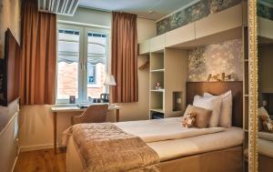 Postel nebo postele na pokoji v ubytování Freys Hotel