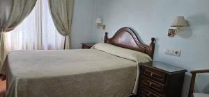 Posteľ alebo postele v izbe v ubytovaní Hotel Chipén