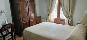 Posteľ alebo postele v izbe v ubytovaní Hotel Chipén