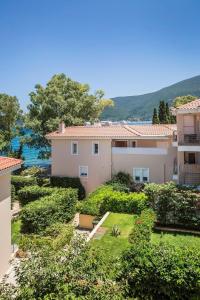 an aerial view of a house with a garden at Deluxe Kefalonia Apartment Apartment Tangerine 1 Bedroom Pool Sea View Karavomilos in Karavomylos