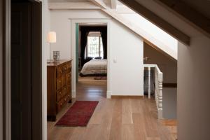 a room with a bed and a dresser and a bedroom at Villa Hvar Royale - 5 Bedroom Central Villa - Indoor Pool - Beautiful Heritage Villa in Hvar +32 photos