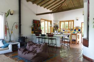a living room with a kitchen and a table at El Romeron Casa de Campo in San Francisco