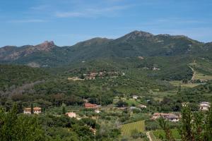 a view of a valley with mountains in the background at Buen Retiro in Portoferraio