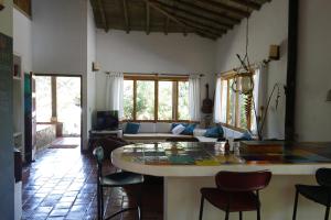 a living room with a table and some chairs at El Romeron Casa de Campo in San Francisco +57 photos