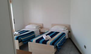 Postel nebo postele na pokoji v ubytování EasyRoom Piovene Rocchette