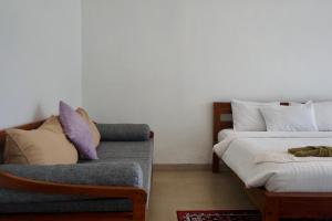 Ένα ή περισσότερα κρεβάτια σε δωμάτιο στο Makati Villa Tulamben +34 φωτογραφίες