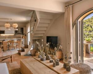 a living room with a table and a large window at Extraordinary Kefalonia Villa Villa Lavi 2 Bedrooms Seafornt Spectacular Sea Views Private Outdoor Pool Assos in Asos