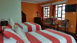 Postel nebo postele na pokoji v ubytování Hotel Margarita 2