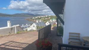 a balcony of a house with a view of the water at Witsand Holiday Flat in Witsand