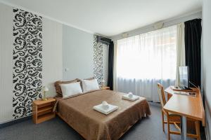 Postel nebo postele na pokoji v ubytování Hotel Rusca