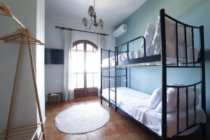 a bedroom with two bunk beds and a window at The Summit Escape House in Achílleion +27 photos