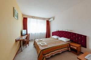 Postel nebo postele na pokoji v ubytování Hotel Rusca