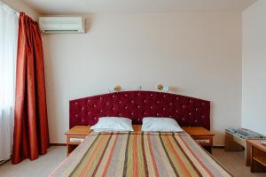 Postel nebo postele na pokoji v ubytování Hotel Rusca
