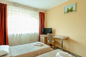 Postel nebo postele na pokoji v ubytování Hotel Rusca