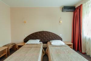 Postel nebo postele na pokoji v ubytování Hotel Rusca